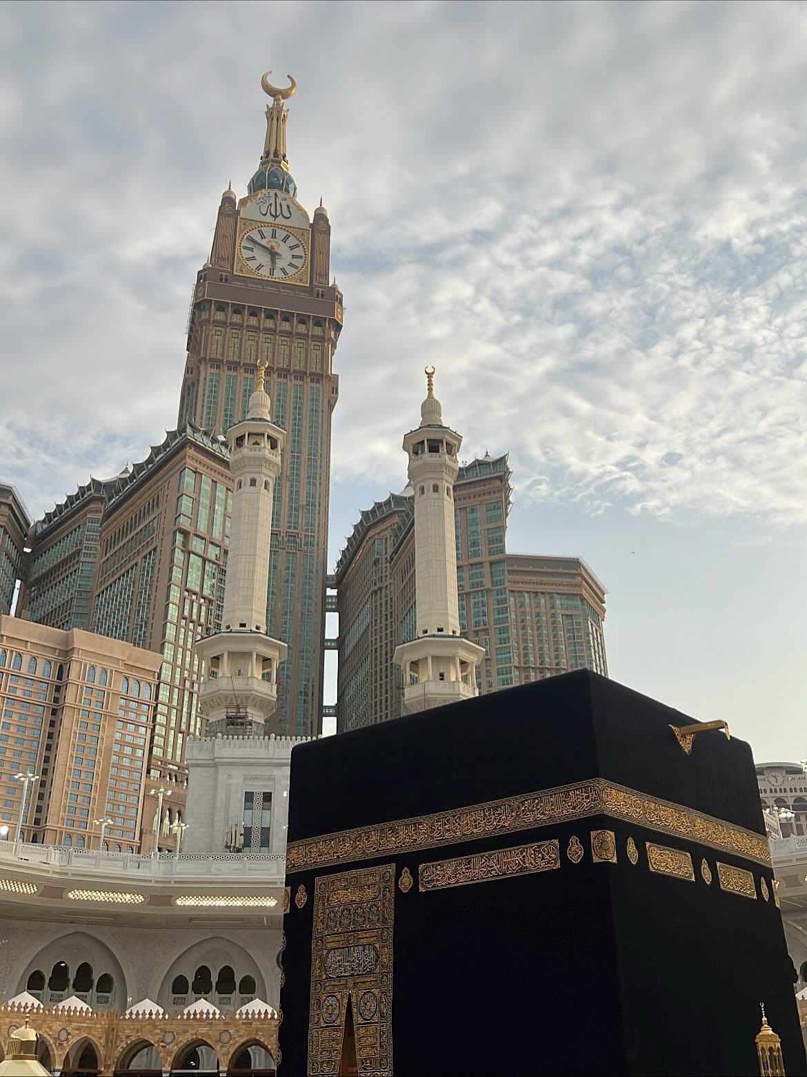 Makkah clock tower and pilgrims